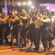 Law-enforcement officers watch during a protest on West Florissant Avenue in Ferguson, Mo., on Aug. 18, 2014, in the wake of the fatal police shooting of Michael Brown.
Michael B. Thomas/AFP/Getty Images